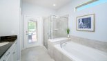 Master ensuite bathroom #1 with walk-in shower, bath, his & hers sinks & separate WC from Baymont 2 Villa for rent in Orlando