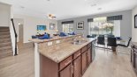 Kitchen viewed towards dining area with this Orlando Villa for rent direct from owner