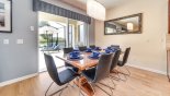 Dining area with large dining table & 8 chairs from Coconut Palm 2 Villa for rent in Orlando