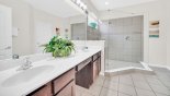 Master ensuite bathroom #1 with enormous walk-in shower, his & hers sinks & separate WC with this Orlando Villa for rent direct from owner