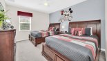 Bedroom #3 with Mickey & Minnie theming and 2 x queen-sized beds - views onto pool deck with this Orlando Villa for rent direct from owner