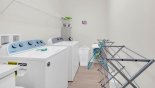 Laundry room with washer, dryer, iron & ironing board from Coconut Palm 2 Villa for rent in Orlando