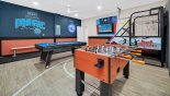 NBA themed games room with basketball game, pool table, table foosball & Roku enabled LCD TV - www.iwantavilla.com is your first choice of Villa rentals in Orlando direct with owner