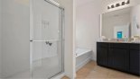 Villa rentals in Orlando, check out the Master #1 ensuite bathroom with large bath, walk-in shower, his & hers sinks & separate WC which also opens out to pool deck