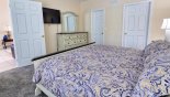 Villa rentals near Disney direct with owner, check out the Master bedroom with wall mounted LCD cable TV