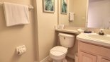 Downstairs cloakroom with WC & vanity sink - www.iwantavilla.com is the best in Orlando vacation Villa rentals