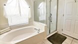 Villa rentals in Orlando, check out the Master ensuite bathroom with bath, walk-in shower & his 'n' hers sinks & WC
