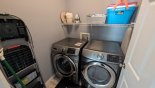 Laundry room with washer, dryer, iron & ironing board from Highlands Reserve rental Villa direct from owner