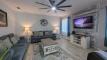 Villa rentals in Orlando, check out the Family room with ample seating to watch a movie on the large wall-mounted LCD cable TV