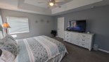 Villa rentals in Orlando, check out the Master bedroom with large LCD cable TV