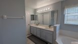 Villa rentals near Disney direct with owner, check out the Master ensuite bathroom with bath, walk-in shower & his 'n' hers sinks & separate WC