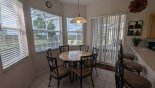 Huntington 1 Villa rental near Disney with Breakfast nook adjacent to kitchen with seating for 6 and views onto pool deck