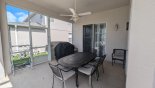 Covered lanai offers welcome shade when alfresco dining - gas BBQ is a rental unit with this Orlando Villa for rent direct from owner