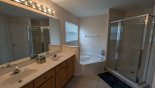 Villa rentals in Orlando, check out the Master ensuite bathroom #1 with roman bath, walk-in shower, his & hers sinks & separate WC