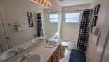 Spacious rental Highlands Reserve Villa in Orlando complete with stunning Family bathroom #2 with bath & shower over, his & hers sinks and WC